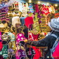 Knitted hats and other winter woolies (1223 visits) Innsbruck Christmas market stall selling colourful winter accessories Knitted hats and other winter woolies